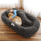 Person and golden retriever asleep in the dark grey CalmCurl human dog bed