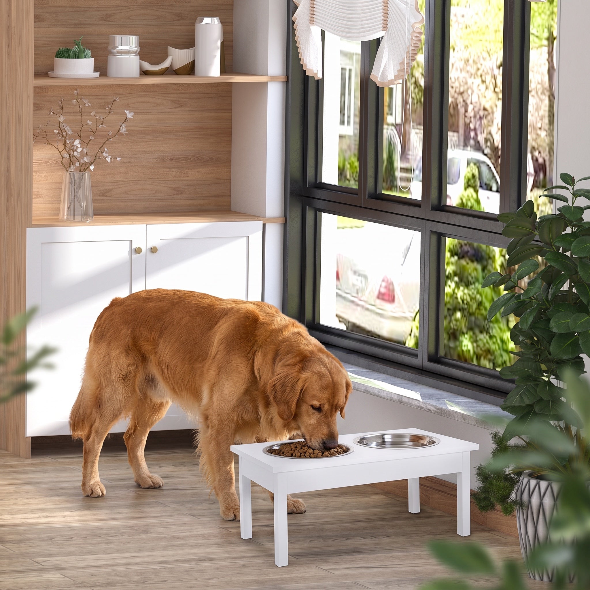 Golden retriever eating from a white elevated feeding station with two stainless steel bowls