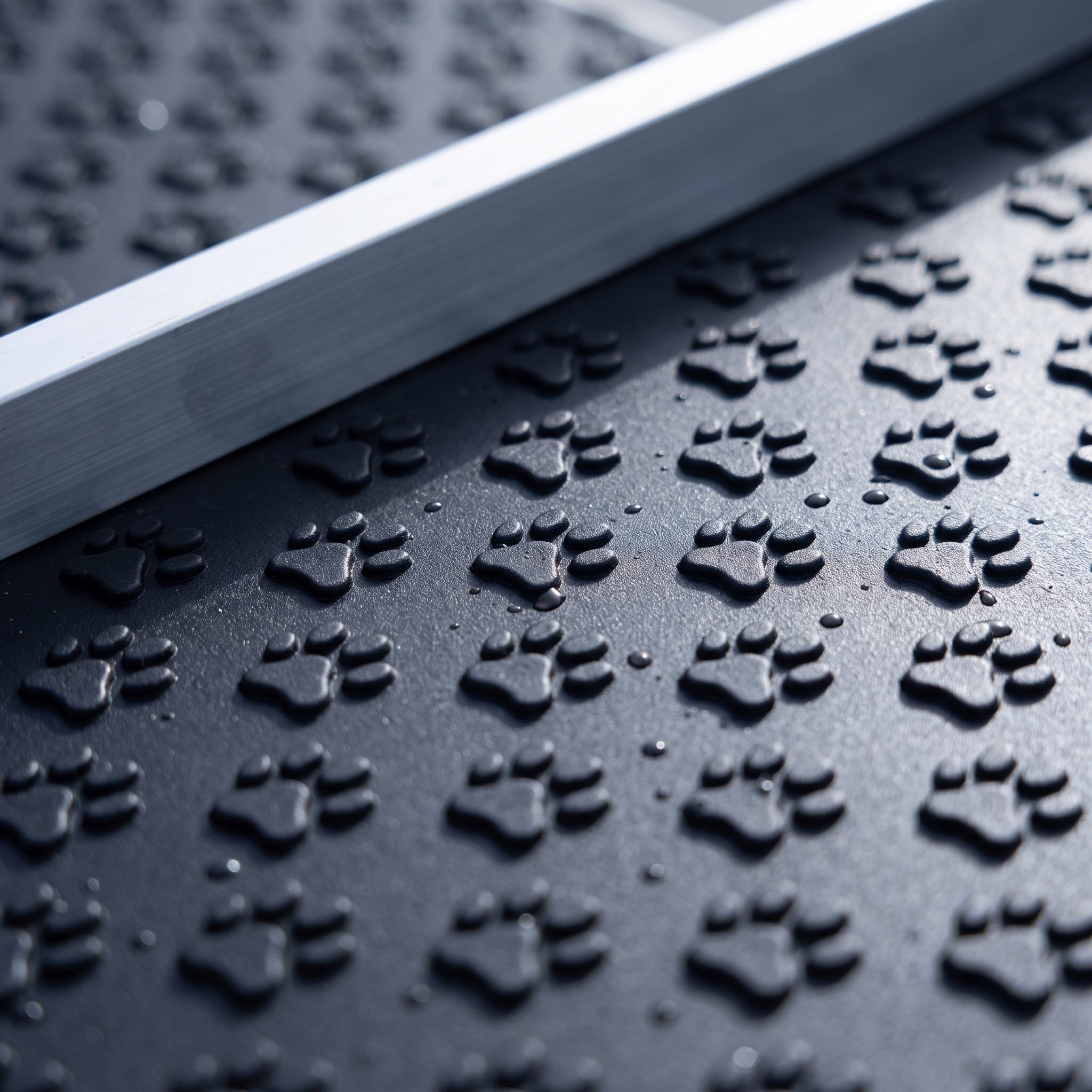 Close view of the paw-print textured non-slip tread on aluminum dog car steps